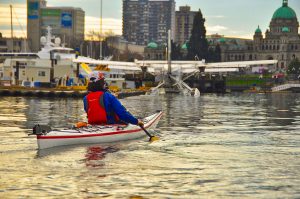 Kayaker & floatplane in Victoria Harbour. BC
